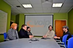 PJ Tudisco (far right), Project Manager of VoIP Supply, relies on clear communication to keep teams on task.